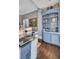 Beautiful, compact wet bar with a gray countertop and wood flooring at 208 Sumter Ave, Summerville, SC 29483