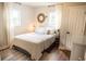 Bright bedroom featuring a comfortable bed with wooden floor, two windows, and light-colored walls at 2157 Jeff St, North Charleston, SC 29405