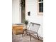 Close-up of a quaint front porch with a bench, potted plant, and a view of the home's exterior at 2157 Jeff St, North Charleston, SC 29405
