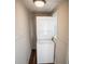Compact laundry area showcasing a stacked washer and dryer unit, maximizing space efficiency in a bright setting at 2157 Jeff St, North Charleston, SC 29405