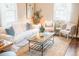 Cozy living room featuring comfortable seating, a stylish coffee table, and natural light from the windows at 2157 Jeff St, North Charleston, SC 29405