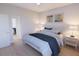 Cozy bedroom with a plush bed, stylish lighting, and decorative wall art at 2161 W Jimtown Dr # 101, North Charleston, SC 29405