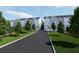 Modern townhome community with gray siding, well-maintained lawns, and a scenic walkway at 2161 W Jimtown Dr # 101, North Charleston, SC 29405