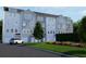 Townhome community featuring gray and white siding, attached garages, and landscaped grounds at 2161 W Jimtown Dr # 101, North Charleston, SC 29405