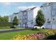 Well-maintained townhome community with gray siding, manicured lawns, and mature landscaping at 2161 W Jimtown Dr # 101, North Charleston, SC 29405