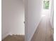 Upstairs hallway with wooden floors and natural lighting from the windows at 2161 W Jimtown Dr # 101, North Charleston, SC 29405
