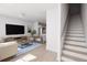 Bright, spacious living room, seamlessly connecting to the kitchen and stairway at 2161 W Jimtown Dr # 101, North Charleston, SC 29405