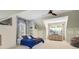 Stylish bedroom offering a ceiling fan, large window, and built in shelves for ample storage at 2228 Daniel Island Dr, Charleston, SC 29492