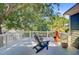 Outdoor deck with relaxing seating area, surrounded by mature trees for added privacy at 2228 Daniel Island Dr, Charleston, SC 29492