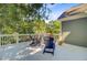 Comfortable outdoor deck seating area with views of a lush, mature backyard at 2228 Daniel Island Dr, Charleston, SC 29492