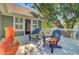 Outdoor patio with comfortable chairs overlooking a lush, private backyard at 2228 Daniel Island Dr, Charleston, SC 29492