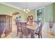 Light and airy dining room with hardwood floors, elegant table, and modern decor at 2228 Daniel Island Dr, Charleston, SC 29492