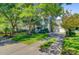 Charming two-story home boasts a well-maintained lawn, mature trees, and a driveway leading to a two-car garage at 2228 Daniel Island Dr, Charleston, SC 29492