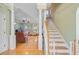 Grand foyer features gleaming hardwood floors, elegant staircase, and a seamless transition to the living spaces at 2228 Daniel Island Dr, Charleston, SC 29492
