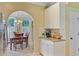View of the kitchen cabinet space with a doorway leading to a dining room area at 2228 Daniel Island Dr, Charleston, SC 29492