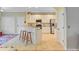 Bright kitchen featuring white cabinets, stainless steel appliances, and a cozy breakfast bar at 2228 Daniel Island Dr, Charleston, SC 29492