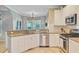 Granite countertops and stainless steel appliances accent this kitchen view from the sink at 2228 Daniel Island Dr, Charleston, SC 29492