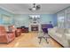 Bright living room with hardwood floors, fireplace, comfortable seating, and natural light creates a welcoming atmosphere at 2228 Daniel Island Dr, Charleston, SC 29492