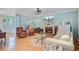 Inviting living room with a brick fireplace, comfortable seating, and plenty of space for relaxation and entertaining at 2228 Daniel Island Dr, Charleston, SC 29492