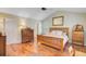 Bright bedroom with wood floors, and wooden dressers, offering a cozy and inviting atmosphere at 2228 Daniel Island Dr, Charleston, SC 29492