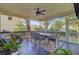 Relaxing screened patio with comfortable seating and a dining area, perfect for outdoor enjoyment at 2228 Daniel Island Dr, Charleston, SC 29492