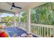 Beautiful outdoor porch with ample seating, a ceiling fan, and scenic views of surrounding trees at 2228 Daniel Island Dr, Charleston, SC 29492