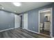 This empty bedroom features two doors; one leading to an en-suite bathroom at 227 Grace St, Walterboro, SC 29488