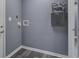 Laundry room features new, gray A. O. Smith tankless water heater and hookups for washer and dryer at 227 Grace St, Walterboro, SC 29488