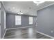 Spacious living room with gray walls, modern light fixtures, and stylish vinyl flooring at 227 Grace St, Walterboro, SC 29488