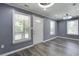 Bright living room with gray walls, modern light fixtures, and stylish vinyl flooring at 227 Grace St, Walterboro, SC 29488