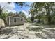 Side yard with a wooden privacy fence and view of the home's gray siding at 227 Grace St, Walterboro, SC 29488