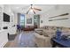 Bright living room with a fireplace, built-in shelving, and ample seating, perfect for entertaining at 2514 Myrtle Ave, Sullivans Island, SC 29482