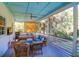 Relaxing screened porch furnished with comfortable seating and a daybed, offering a serene outdoor space at 2514 Myrtle Ave, Sullivans Island, SC 29482