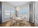 Bright dining area features a round table and decorative chandelier at 274 Tupelo Lake Dr, Summerville, SC 29486