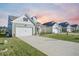 Pleasant home with attached garage, covered front porch, expansive driveway, and appealing curb appeal at 274 Tupelo Lake Dr, Summerville, SC 29486