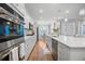 Spacious white kitchen features stainless steel appliances and a long island with seating at 274 Tupelo Lake Dr, Summerville, SC 29486