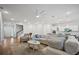 Bright living room featuring a comfortable sofa, ceiling fan, hardwood floors and an open layout at 274 Tupelo Lake Dr, Summerville, SC 29486