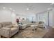 Living room showcasing an oversized patterned chair, hardwood floors, ceiling fan and an open layout at 274 Tupelo Lake Dr, Summerville, SC 29486