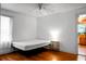 Clean and simple bedroom design with a bed frame, hardwood floors, and natural light at 286 Mallard Lake Rd, Dorchester, SC 29437