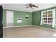 Spacious bedroom with tile floors, ceiling fan, and ample natural light from the windows at 286 Mallard Lake Rd, Dorchester, SC 29437