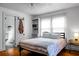 Bright bedroom with hardwood floors, closet storage, and a connected bathroom featuring a neutral color palette at 286 Mallard Lake Rd, Dorchester, SC 29437