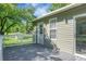 Charming home exterior with a gray deck, sliding glass door, and a view of the yard and greenery at 286 Mallard Lake Rd, Dorchester, SC 29437