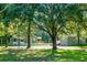 Exterior showing multiple buildings and structures with well-maintained lawns and mature trees, creating a tranquil setting at 286 Mallard Lake Rd, Dorchester, SC 29437