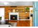 Inviting living room features wood paneled walls, a fireplace, and a view into other rooms of the house at 286 Mallard Lake Rd, Dorchester, SC 29437