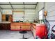 Workshop interior featuring a large workbench, tool storage, and ample lighting at 286 Mallard Lake Rd, Dorchester, SC 29437
