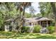 This home boasts a spacious back deck and screened porch, perfect for relaxing and enjoying the lush greenery at 2938 Old Drake Dr, Seabrook Island, SC 29455