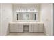 Bright bathroom featuring a large vanity with double sinks, a spacious mirror, and neutral-tone decor at 2938 Old Drake Dr, Seabrook Island, SC 29455