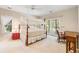 Cozy bedroom with a canopy bed, access to the outdoors, and a bright, inviting atmosphere at 2938 Old Drake Dr, Seabrook Island, SC 29455