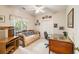 Inviting room with daybed, ceiling fan, and natural light, that can serve as a bedroom or home office at 2938 Old Drake Dr, Seabrook Island, SC 29455