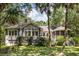 Charming exterior view of the home, showcasing architectural details and a well-maintained landscaped yard at 2938 Old Drake Dr, Seabrook Island, SC 29455